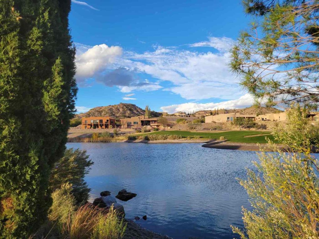 view across a pond at turtleback mountain resort elephant butte